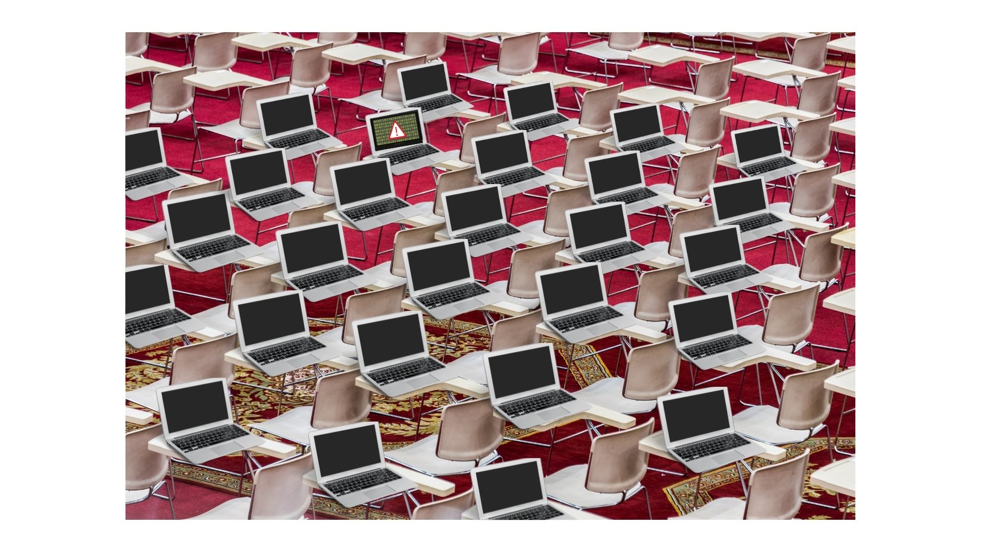 Image: A classroom full of computers, one of which has a virus.